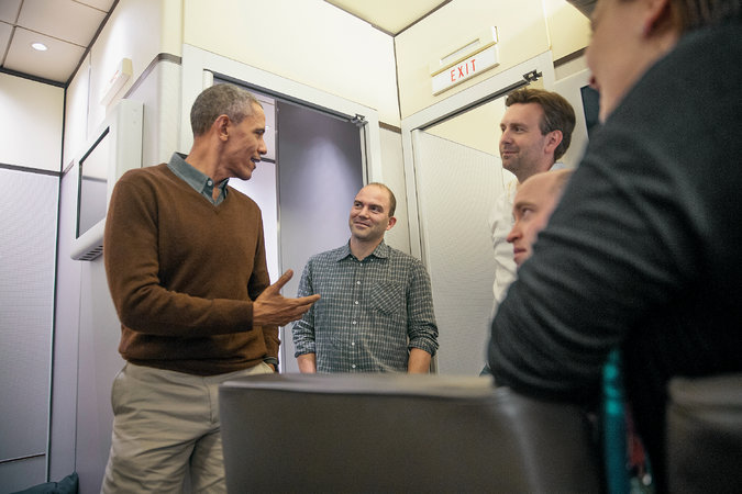 Rhodes (center) and Josh Earnest, the White House press secretary, listening as President Obama spoke to reporters during an off-the-record discussion. Credit Stephen Crowley/The New York Times